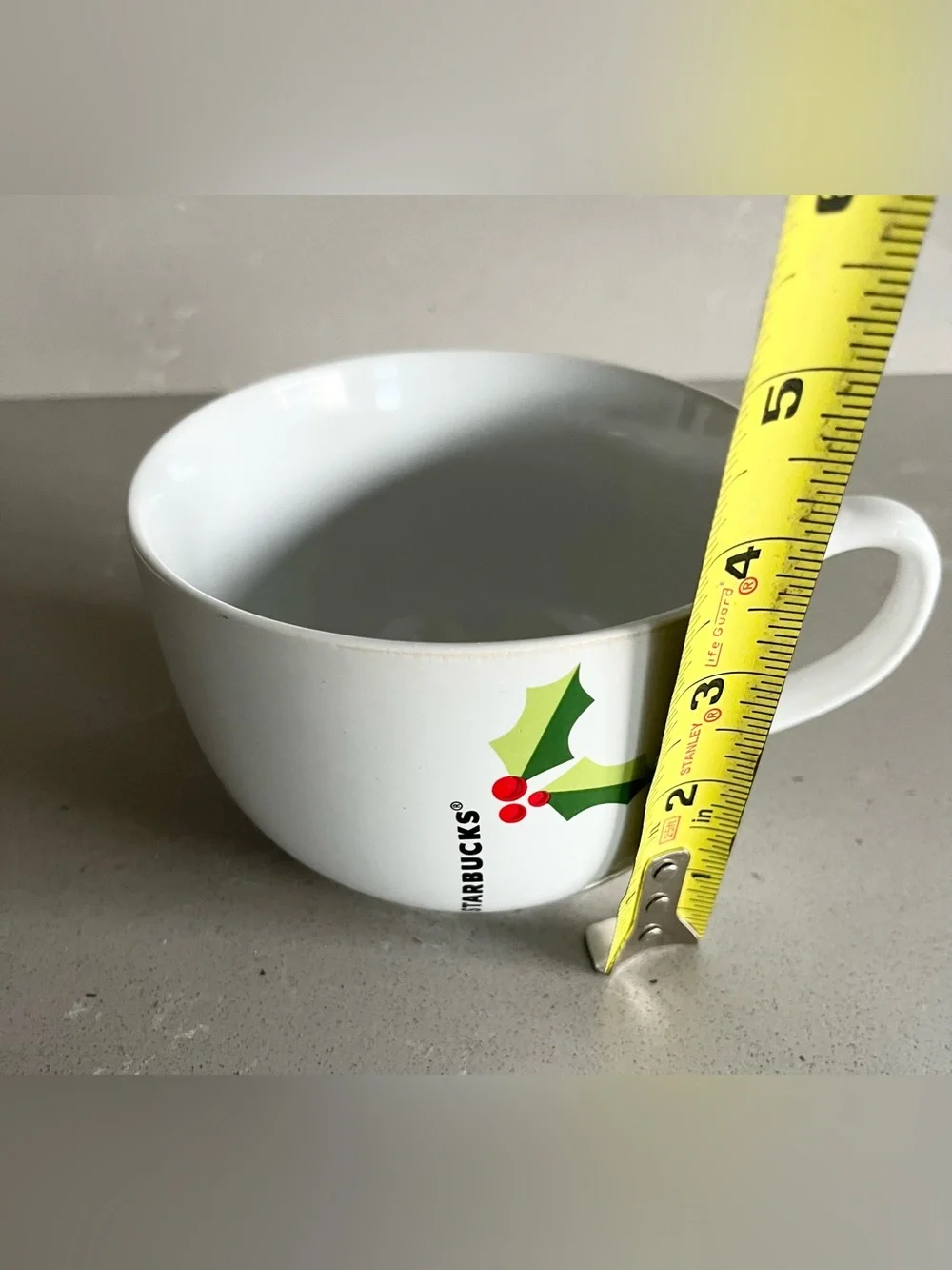 Starbucks holiday mug is in excellent condition. White oversized mug reads STARB
